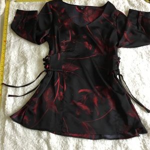 Satin feeling, hip length dress shirt.